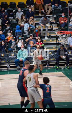 College Basketball player Shooting a made shot Stock Photo