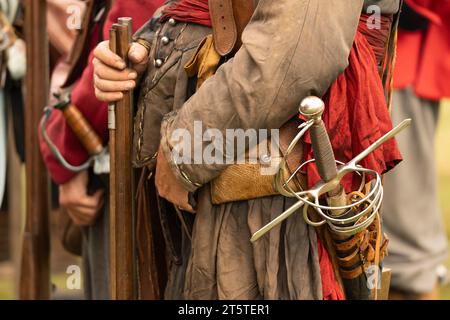 Closeup detail of a musketeer with a sword and a red sash showing he was royalist infantry. English civil war - the Siege of Basing House 16.09.23 Stock Photo