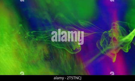 Neon mist floating paint water flow green purple Stock Photo