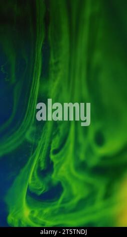 Neon mist paint water wave green blue ink mix flow Stock Photo