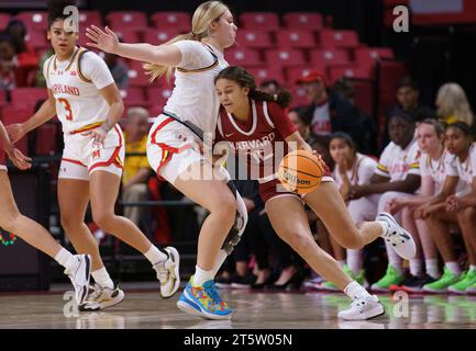 College Park, USA. 06th Nov, 2023. COLLEGE PARK, MD - NOVEMBER 06: Harvard Crimson guard Karlee White (12) pushes past Maryland Terrapins guard Emily Fisher (34) during a women's college basketball game between the Maryland Terrapins and the Harvard Crimson on November 06, 2023, at Xfinity Center, in College Park, Maryland. (Photo by Tony Quinn/SipaUSA) Credit: Sipa USA/Alamy Live News Stock Photo