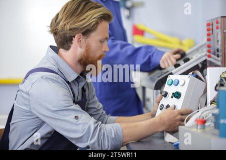 a man is operating machine Stock Photo