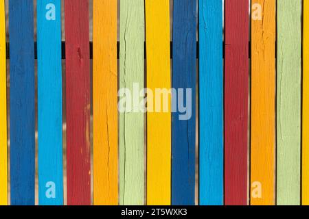 Colored fence boards painted in different colors Stock Photo