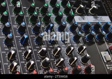 Close-up shot of rows of control knobs and buttons on a digital multi effect processor unit - professional technology for the music industry Stock Photo