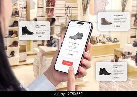 Trendy footwear in a shoe shop. Online app on a smartphone with a buy now button. Floating balloons suggesting shoe recommendations Stock Photo
