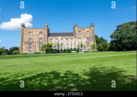 Lumley Castle is a 14th-century quadrangular castle at Chester-le-Street in the North of England, Stock Photo