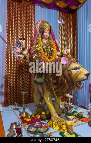 A beautiful idol of Maa Durga being worshipped at a pandal during Navratri in Mumbai, India Stock Photo