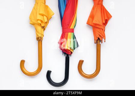 Different stylish umbrellas on white background Stock Photo