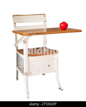 Retro style school desk with a red apple on top Stock Photo