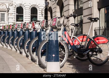 A row of Santander (aka Boris Bike) parked on Wellington Street in London's West End, England, U.K. Stock Photo