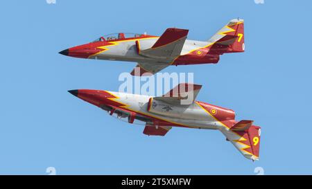 Two Spanish Airforce CASA C-101 Aviojets fly belly-to-belly at RIAT 2023. They are part of the 6 aircraft display team knows as the Patrulla Aguila (E Stock Photo