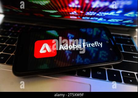 In this photo illustration, an Adobe Firefly logo is displayed on a smartphone. Stock Photo