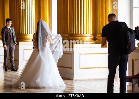 Saint Petersburg, Russia - August 03, 2023: wedding photo shoot in the interiors of the Winter Palace in St. Petersburg Stock Photo