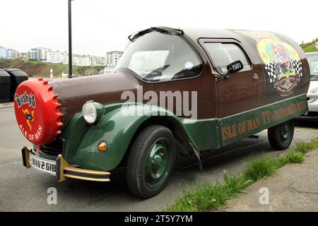 Promotional beer bottle car, based on a Citroen 2CV, for Bushy's Premium Manx Ale, Port Erin, Isle of Man. Stock Photo