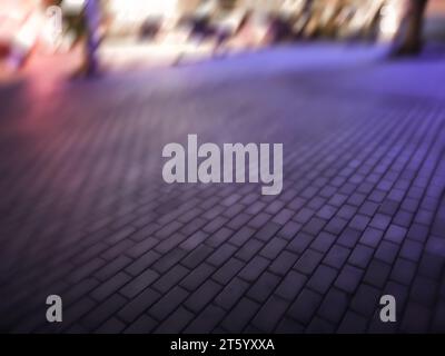 Abstract night light bokeh defocused background. Blurred  urban building background scene. Stock Photo