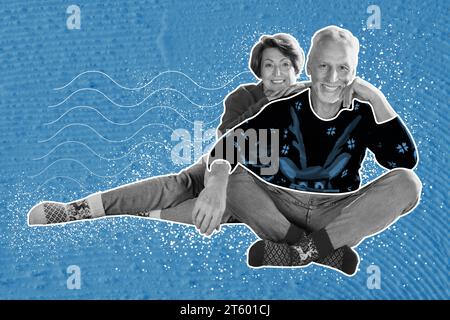 Creative collage picture of two positive black white colors partners cuddle enjoy christmastime fairy isolated on painted blue background Stock Photo