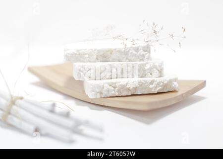 Soap dish with white soap bars on light background. Handmade soap with white background. Handmade organic soap concept. closeup Stock Photo