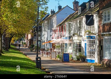 Tenterden High Street, wide pavement with shops and cafes, on a sunny  autumn day, Kent, UK Stock Photo