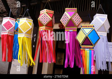 Pune, Maharashtra, India, Nov. 06, 2023 - Colorful traditional Lanterns in Various Shapes Akash kandil (Diwali decorative lamps) Hang out side shop. Stock Photo