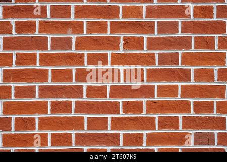 Background from a red brick wall with white joints Stock Photo