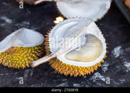 Durian fruit cut in half, a smelly fruit, a specific fruit from Asia Stock Photo