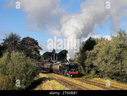 9F 92134 departs from Goathland on 22.10.23 with a service for Pickering. Stock Photo