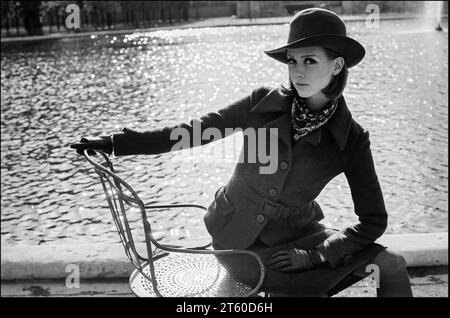 1960s, woman fashion model with hat sitting on chair, Jardin des Tuileries garden, Paris, France, Europe, Stock Photo