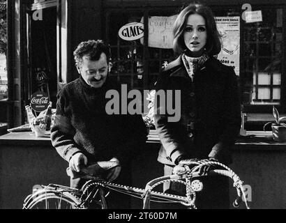 1960s, woman fashion model with food and drink kiosk manager, Jardin des Tuileries garden, Paris, France, Europe, Stock Photo