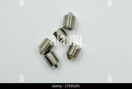 DIN 0914 bolts screws close up macro detailed on white reflective background Stock Photo
