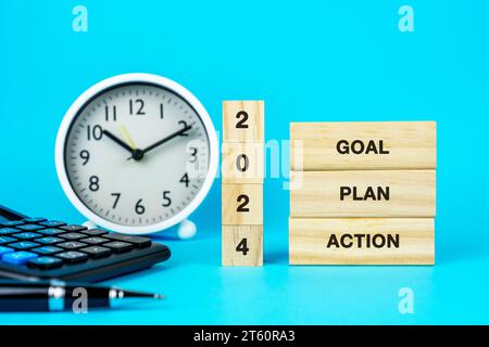 Premium Photo  2024 goal plan action business common goals for planning  new project annual plan business target achievement wooden cubes with 2024