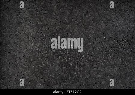 Black polystyrene packing texture background macro close up view Stock Photo