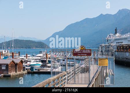 Vancouver, CANADA - Jun 28 2023 : Sewell's Marina at Horseshoe Bay Public Dock in sunny day. Horseshoe Bay is a major ferry terminal owned and operate Stock Photo