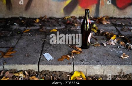 PRODUCTION - 02 November 2023, Lower Saxony, Lüneburg: A fake bottle and syringe residue can be found under a bridge. More people than before fell through social safety nets, and some from middle-class families ended up on the street. Photo: Philipp Schulze/dpa Stock Photo