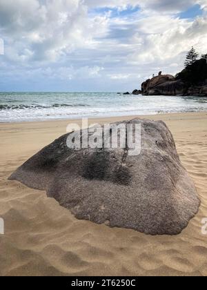 Rock on Balding Bay Beach at Magnetic Island in Queensland Stock Photo