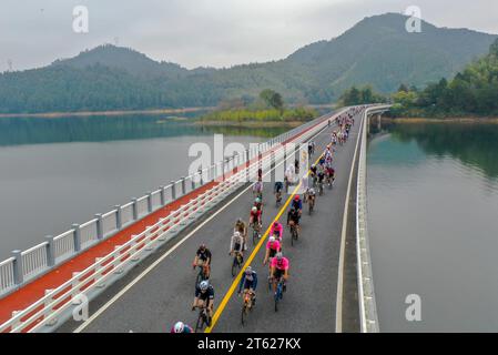 The 17th Qiandao Lake Road Cycling Race kicks off in Chun'an County, Hangzhou City, east China's Zhejiang Province, 5 November, 2023. Stock Photo