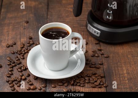 Filter coffee brewed in a filter coffee machine in a white porcelain cup Stock Photo