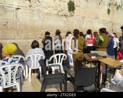 JERUSALEM, ISRAEL - MAY 15, 2015: Israeli Jewish women and soldiers praying at the Western Wall in Jerusalem Stock Photo
