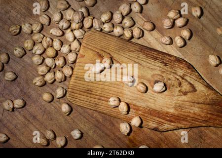 Close-up of some chickpeas on wooden table Stock Photo