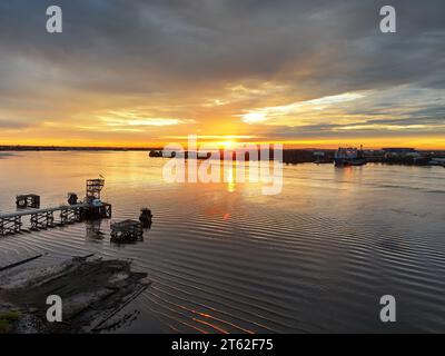 Aerial View of Sun Setting over the Water Stock Photo