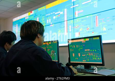 Luannan County - October 19, 2016: technical personnel in the monitoring and production system, Luannan, Hebei, China, Stock Photo