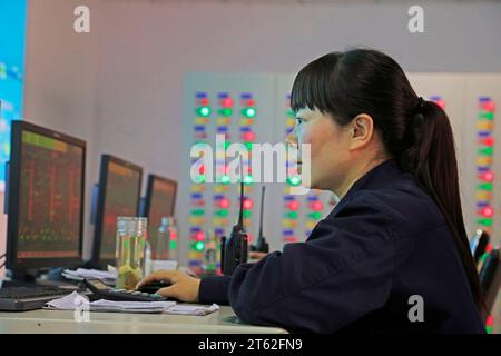 Luannan County - October 19, 2016: technical personnel in the monitoring and production system, Luannan, Hebei, China, Stock Photo