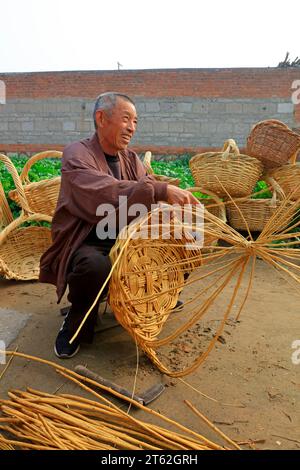 Luannan County - October 19, 2016: a Chinese peasant hand woven basket, Luannan County, Hebei Province, China Stock Photo