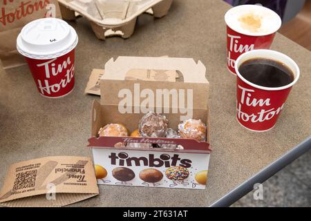 Tim Hortons coffee shop, coffee and food. A canadian cafe restaurant. Coffee cups and Timbits close up; Halifax Nova Scotia Canada. Stock Photo