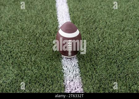photo american football ball on stadium background Stock Photo