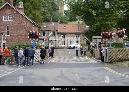 Automatic lifting barriers at the level crossing on the North Yorkshire Moors Railway at Pickering. Stock Photo