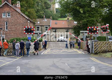 Automatic lifting barriers at the level crossing on the North Yorkshire Moors Railway at Pickering. Stock Photo