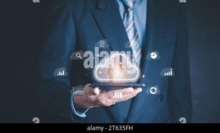 man use Laptop with cloud computing diagram show on hand. Cloud technology. Data storage. Networking and internet service concept. Stock Photo