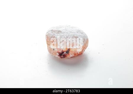 Strawberry filled jam brioche doughnut. Stock Photo