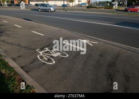 Cycle path with an area dedicated to those who walk, run or walk, nearby there is the cycle path, dedicated to athletes, two wheels, such as bicycles. Stock Photo