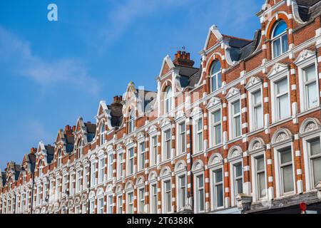 Facade of English terraced houses on Muswell Hill Broadway in London, England Stock Photo